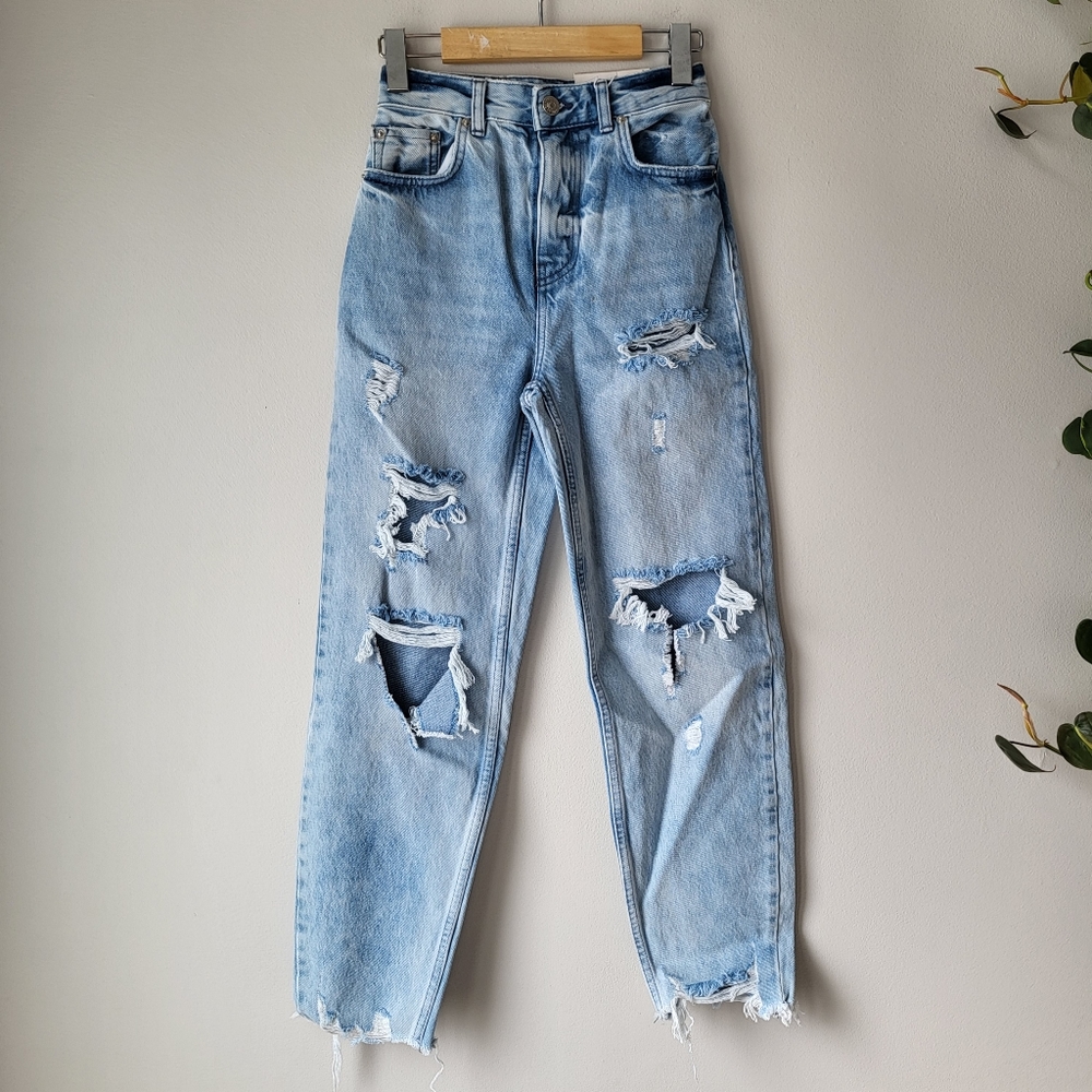 Bershka high waisted mom distressed denim in light denim wash.  Size 00